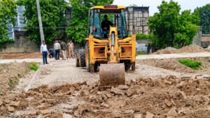 Ghaziabad GDA Action showing GDA officials demolishing illegal construction and sealing an unauthorized building in Ghaziabad.